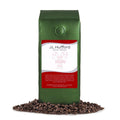 1 lb J.L. Hufford Christmas Cookie Decaf Coffee beans bag with coffee beans in front displayed on a white background
