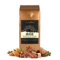 1 lb cinnfulnut coffee bag with 'J.L. Hufford' branding, cinnamon sticks, and hazelnuts on a white background