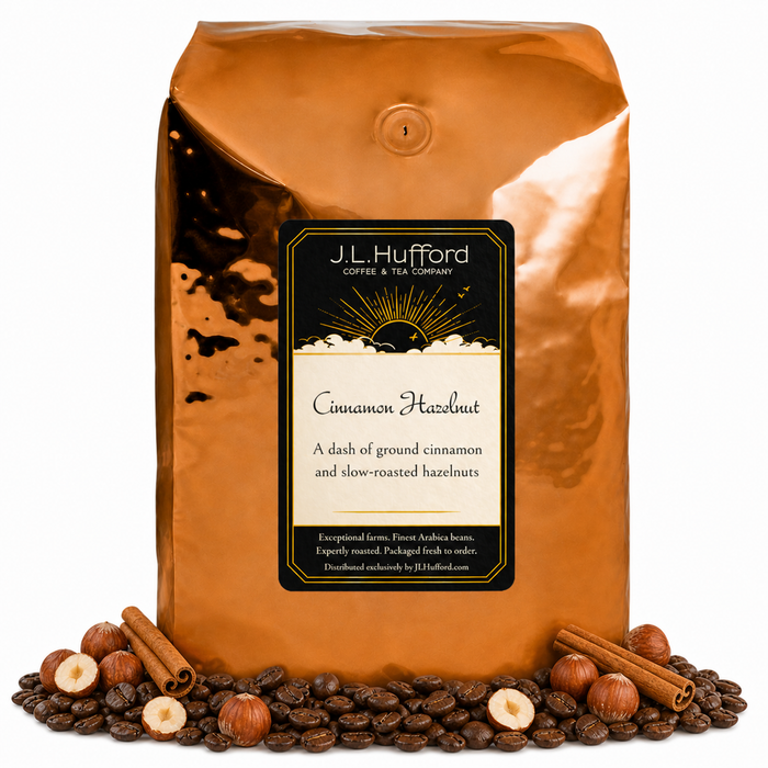 5 lb Cinnamon Hazelnut coffee beans bag with coffee beans, cinnamon sticks, and hazelnuts in front displayed on a white background