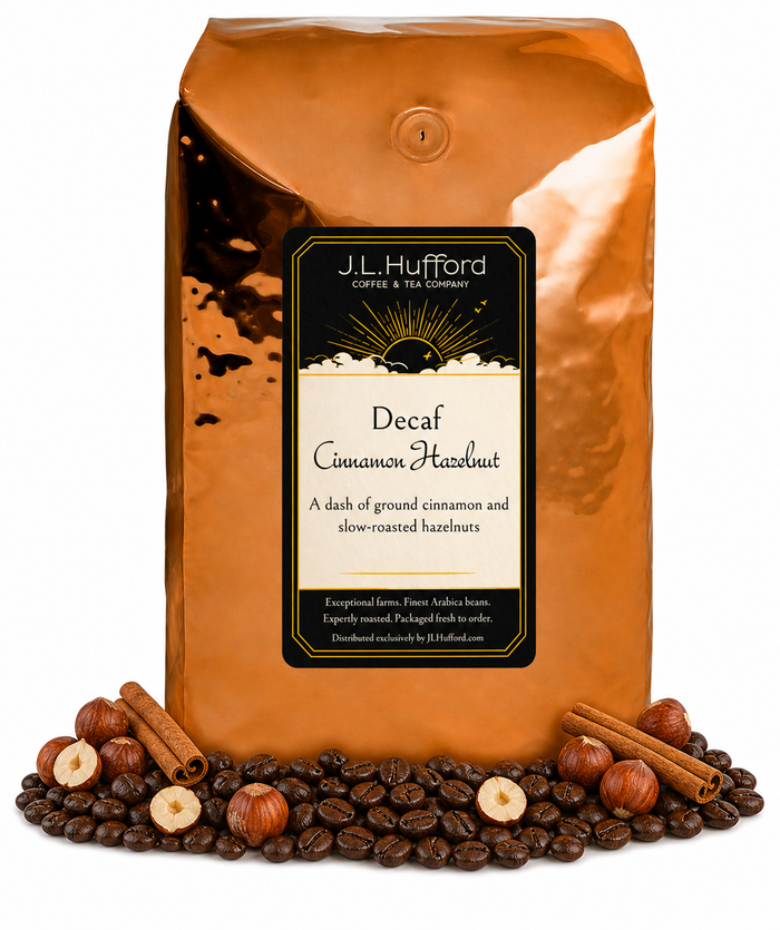5 lb Decaf Cinnamon Hazelnut coffee beans bag with coffee beans, cinnamon sticks, and hazelnuts in front displayed on a white background