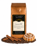 1 lb Cinnamon Roll coffee beans bag with coffee beans, cinnamon sticks, and cinnamon roll in front displayed on a white background