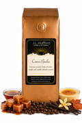 1 lb Creme Brulee coffee beans bag with coffee beans, blocks of caramel, maple syrup, vanilla sticks, and custard in front displayed on a white background