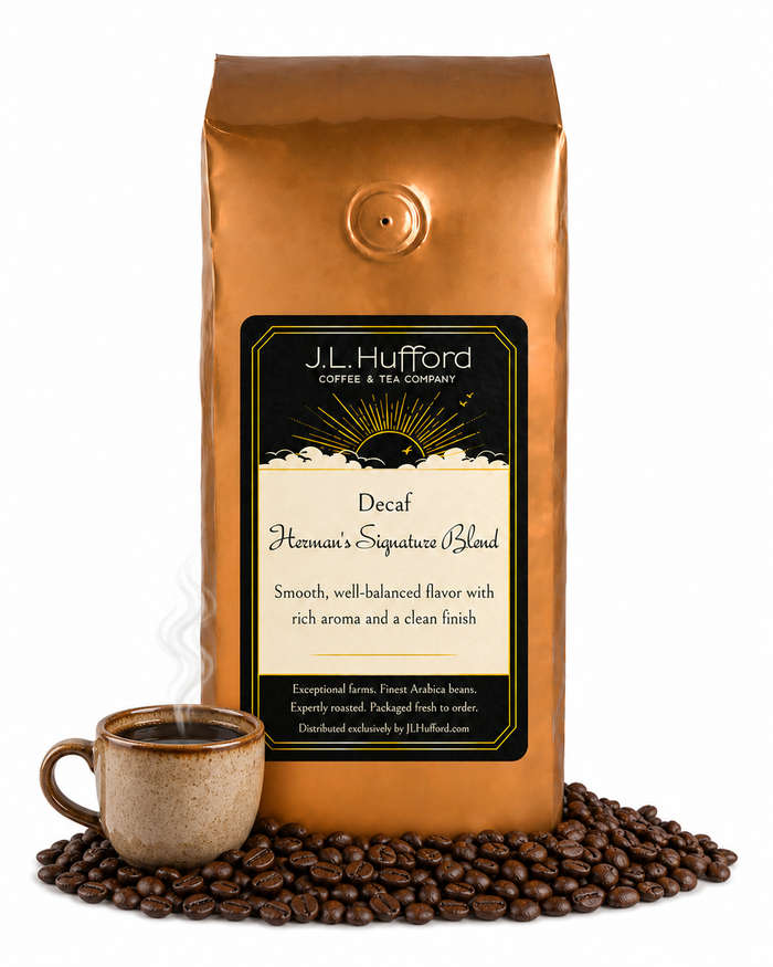 1 lb J.L. Hufford Decaf Herman's Signature Blend coffee bag with coffee beans and mug of coffee on a white background