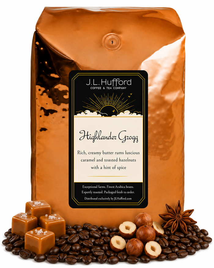 5 lb J.L. Hufford Highlander Grogg coffee bag with coffee beans, blocks of caramel, hazelnuts, and spice on a white background