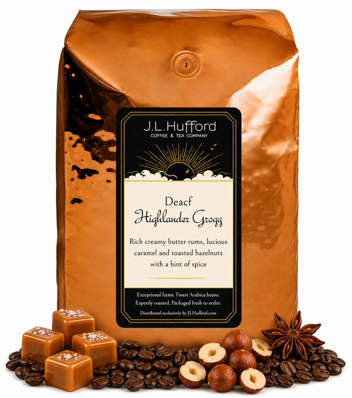 5 lb J.L. Hufford Decaf Highlander Grogg coffee bag with coffee beans, blocks of caramel, hazelnuts, and spice on a white background
