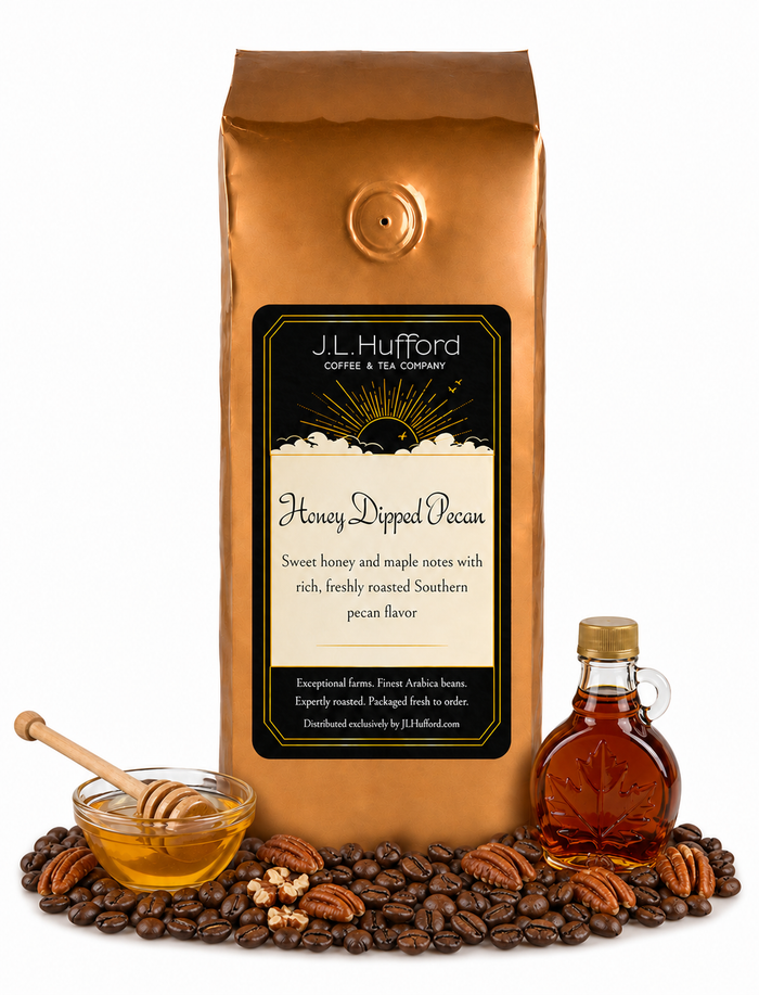 1 lb J.L. Hufford Honey Dipped Pecan coffee bag with coffee beans, pecans, honey, and jar of maple on a white background