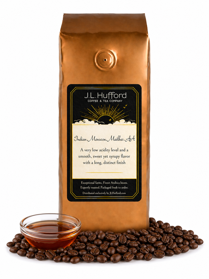 1 lb J.L. Hufford Indian Monsoon Mailbar AA coffee bag with coffee beans and clear bowl of syrup on a white background