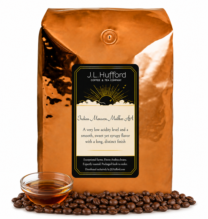 5 lb J.L. Hufford Indian Monsoon Mailbar AA coffee bag with coffee beans and clear bowl of syrup on a white background