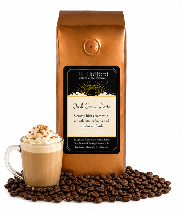 1 lb J.L. Hufford Irish Cream Latte Coffee with coffee beans and glass mug with Irish cream latte in front displayed on a white background