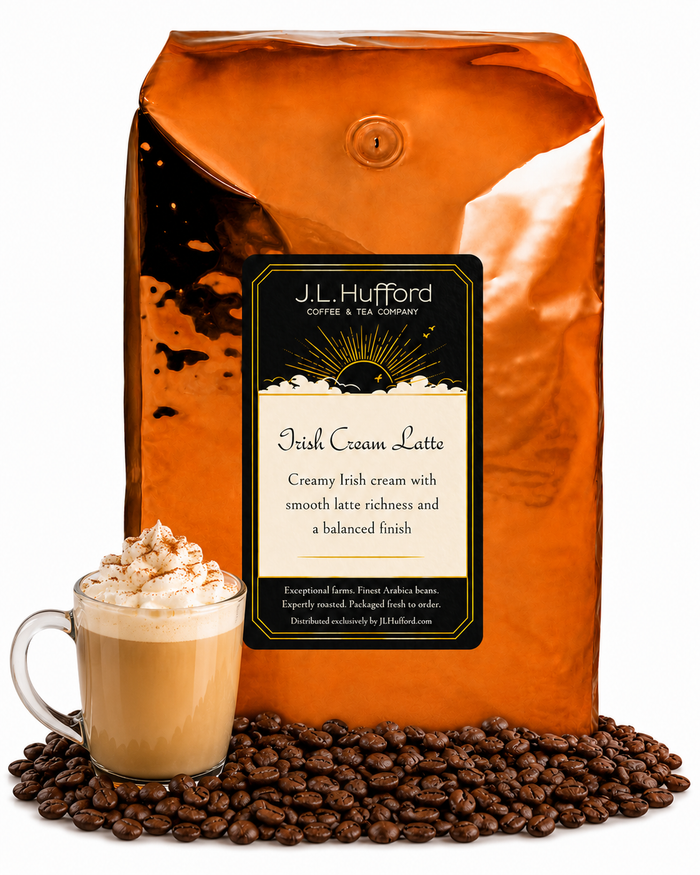 5 lb J.L. Hufford Irish Cream Latte Coffee with coffee beans and glass mug with Irish cream latte in front displayed on a white background