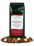 1 lb Kringle Krunch coffee beans bag with coffee beans, pecan, praline, and white chocolate fudge in front displayed on a white background
