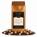 1 lb J.L. Hufford Macadamia Nut Coffee with coffee beans and macadamia nut in front displayed on a white background