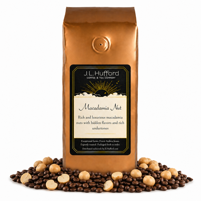 1 lb J.L. Hufford Macadamia Nut Coffee with coffee beans and macadamia nut in front displayed on a white background