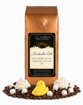 1 lb J.L. Hufford Marshmallow Chick coffee bag with coffee beans, whipped cream, marshmallows, and marshmallow chick on a white background