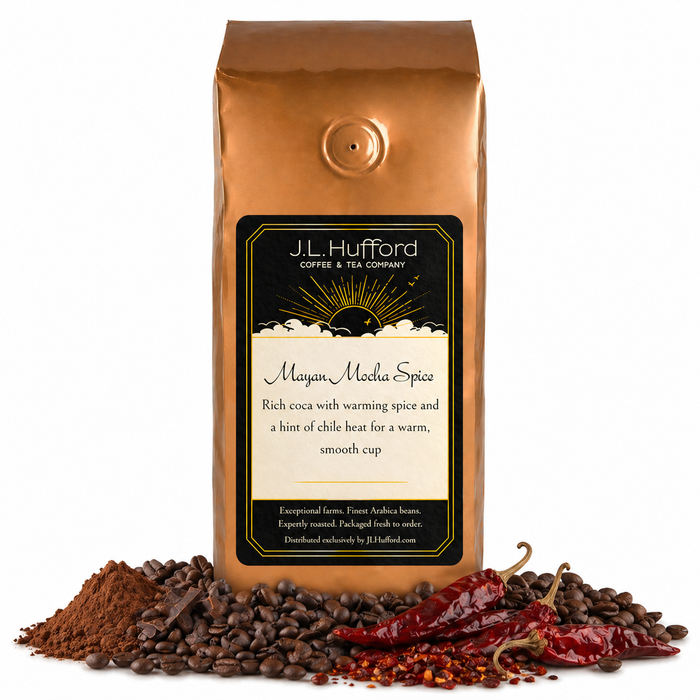 1 lb Mayan Mocha coffee beans bag with coffee beans, coca, chili in front displayed on a white background