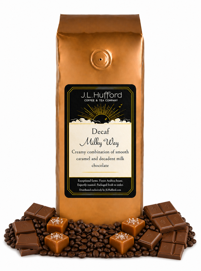 1 lb J.L. Hufford Decaf Milky Way coffee bag with coffee beans, chocolate, and blocks of caramel on a white background