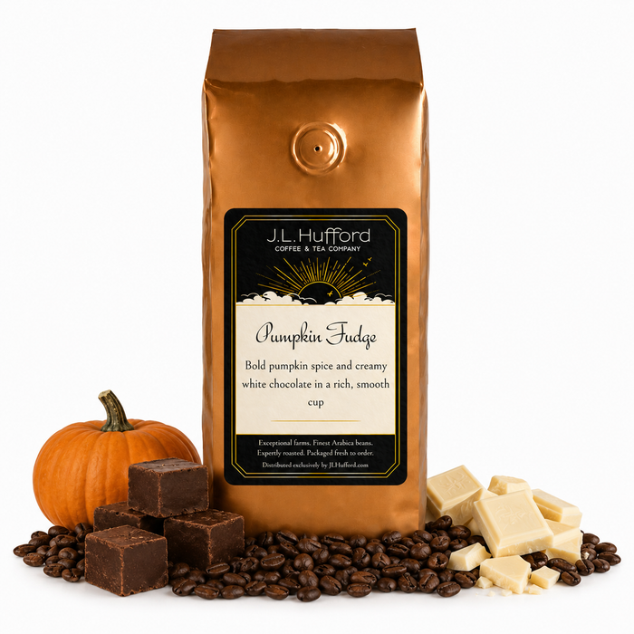 1 lb J.L. Hufford Pumpkin Fudge coffee bag with coffee beans, pumpkin, blocks of fudge, and blocks of white chocolate on a white background
