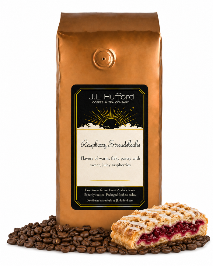 1 lb J.L. Hufford Raspberry Streudelcake coffee bag with coffee beans and a slice of raspberry streudelcake on a white background