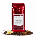 1 lb Simply Sinful coffee beans bag with coffee beans, vanilla, and bar of chocolate drizzled with caramel in front displayed on a white background