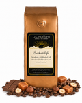 1 lb J.L. Hufford Snickerdelight coffee bag with coffee beans, milk chocolate bar, hazelnuts, and blocks of caramel on a white background