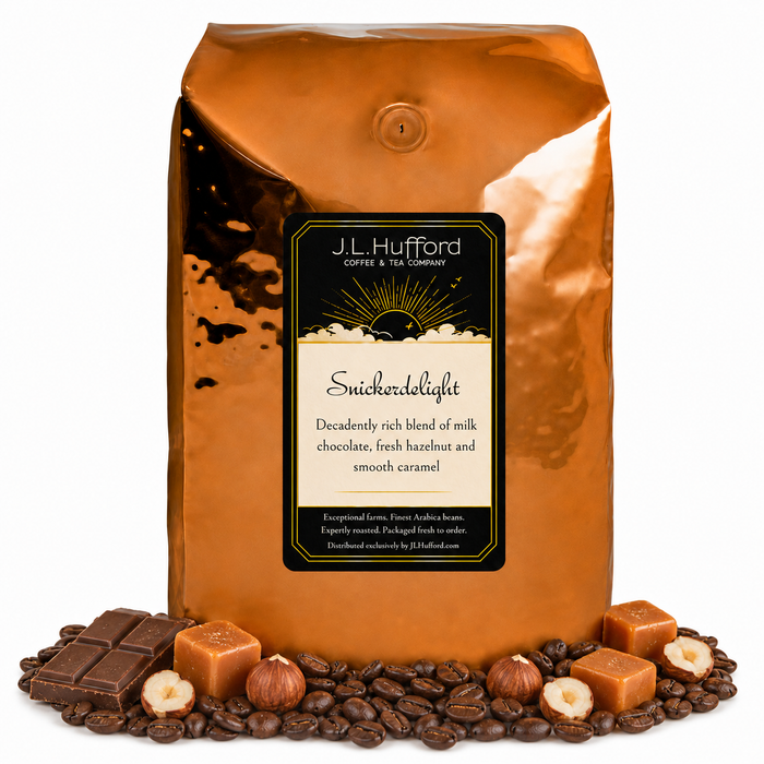 5 lb J.L. Hufford Snickerdelight coffee bag with coffee beans, milk chocolate bar, hazelnuts, and blocks of caramel on a white background