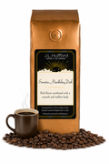 1 lb J.L. Hufford Sumatra Mandheling Dark coffee bag with coffee beans and a mug of coffee on a white background