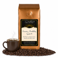1 lb J.L. Hufford Sumatra Mandheling Grade #1 coffee bag with coffee beans and a mug of coffee on a white background