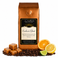 1 lb Sunburst Blend coffee beans bag with coffee beans, salted caramel blocks, and citrus items in front displayed on a white background