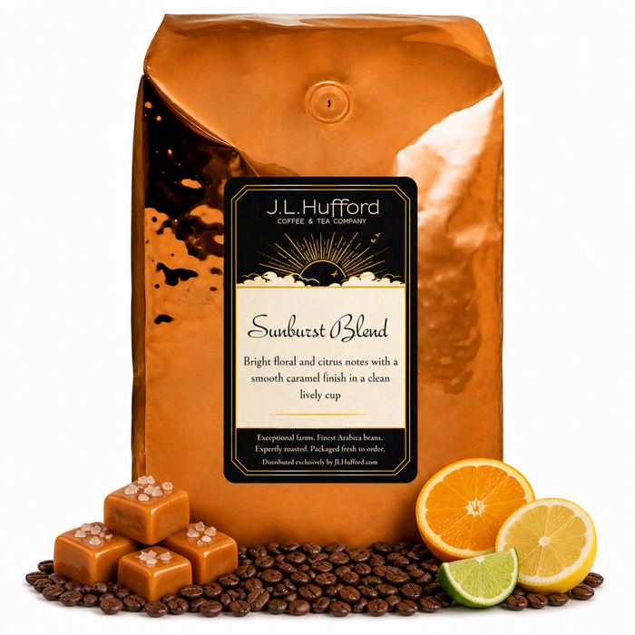 5 lb Sunburst Blend coffee beans bag with coffee beans, salted caramel blocks, and citrus items in front displayed on a white background