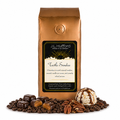 1 lb J.L. Hufford Turtle Sundae coffee bag with coffee beans, pecans, chocolate covered caramel candies, and ice cream with drizzled caramel and fudge on a white background