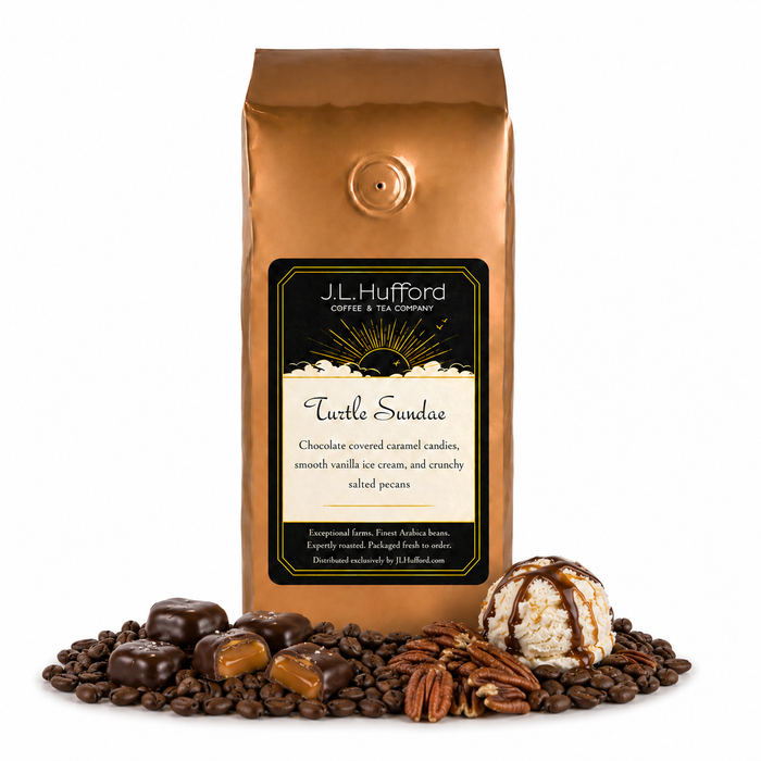 1 lb J.L. Hufford Turtle Sundae coffee bag with coffee beans, pecans, chocolate covered caramel candies, and ice cream with drizzled caramel and fudge on a white background