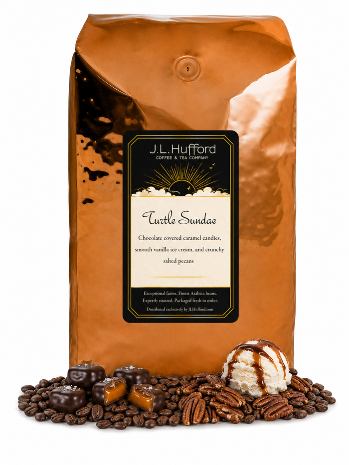 5 lb J.L. Hufford Turtle Sundae coffee bag with coffee beans, pecans, chocolate covered caramel candies, and ice cream with drizzled caramel and fudge on a white background