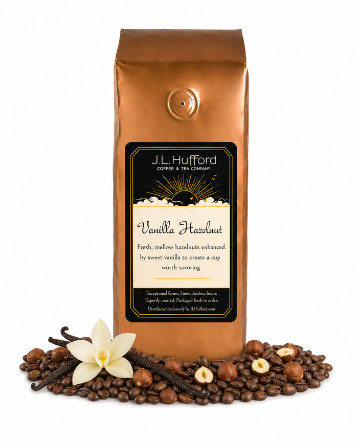 1 lb J.L. Hufford Vanilla Hazelnut coffee bag with coffee beans, vanilla sticks, and hazelnuts on a white background