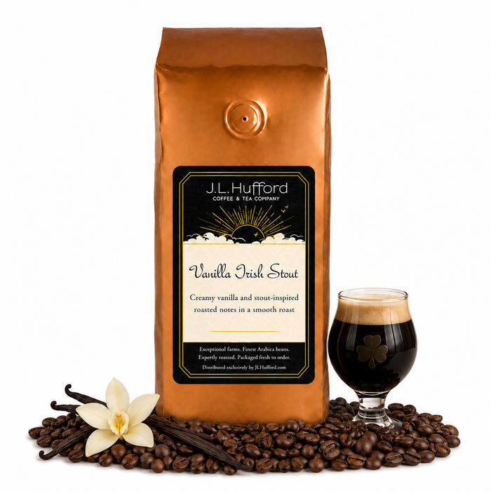1 lb J.L. Hufford Vanilla Irish Stout coffee bag with coffee beans, vanilla sticks, and a glass of Irish Stout on a white background