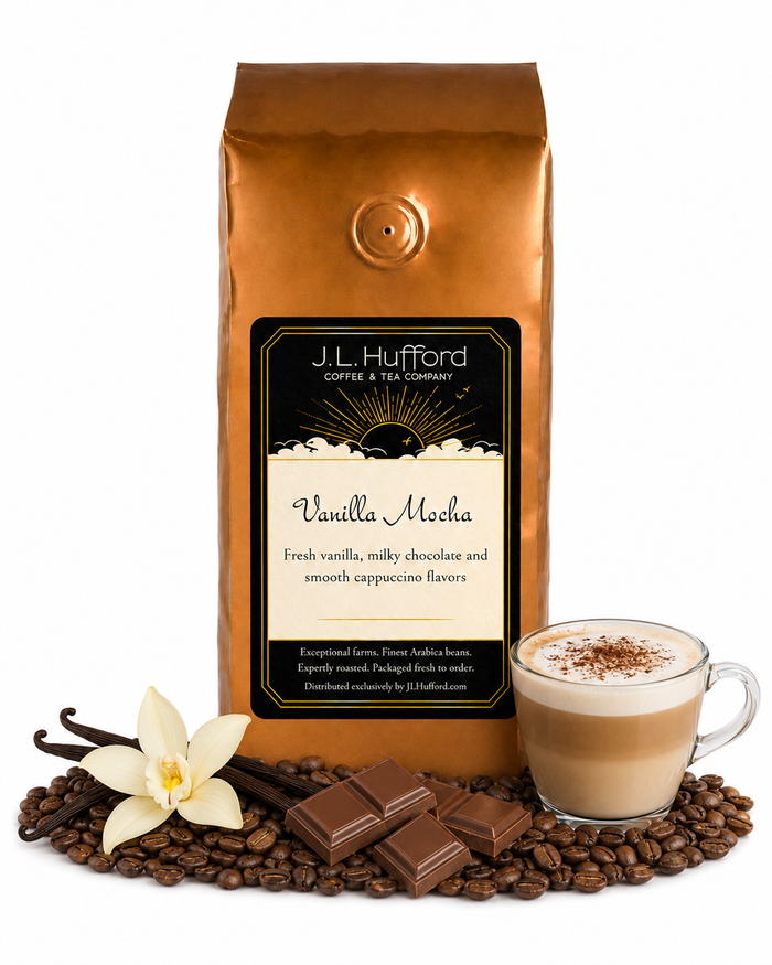 1 lb J.L. Hufford Vanilla Mocha coffee bag with coffee beans, vanilla sticks, milk chocolate, and a glass of a cappuccino on a white background
