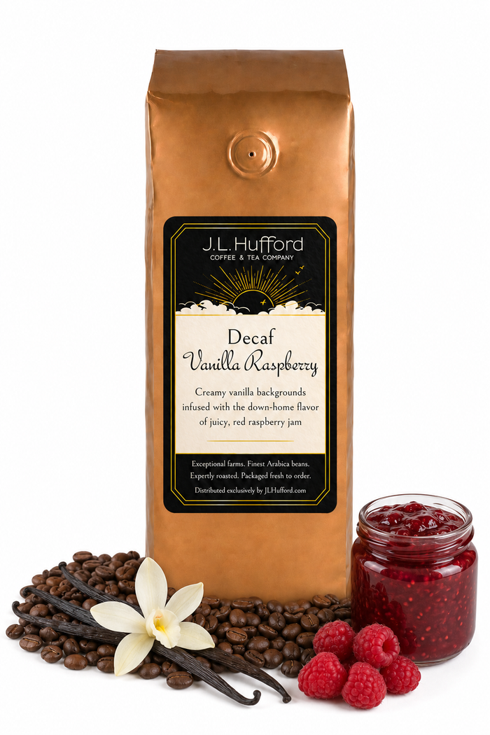 1 lb J.L. Hufford Decaf Vanilla Raspberry coffee bag with coffee beans, vanilla sticks, raspberries, and raspberry jam on a white background