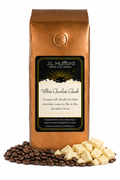 1 lb J.L. Hufford White Chocolate Chunk coffee bag with coffee beans and white chocolate chunks on a white background