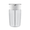 A clear glass milk carafe with a stainless steel lid, featuring a ribbed exterior and a thick base on a white background