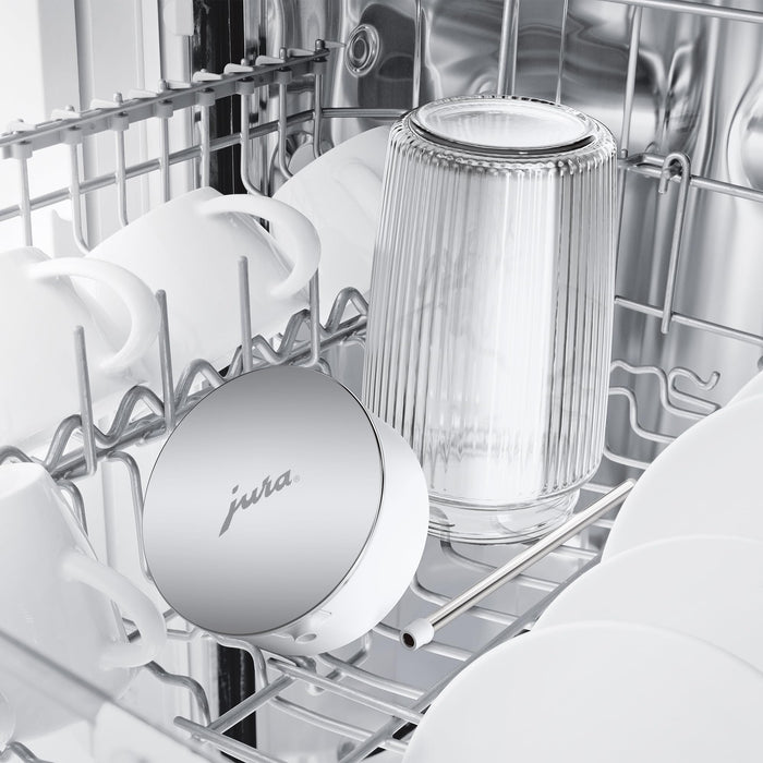 Jura 16.9oz glass milk carafe with lid in the top rack of a dishwasher