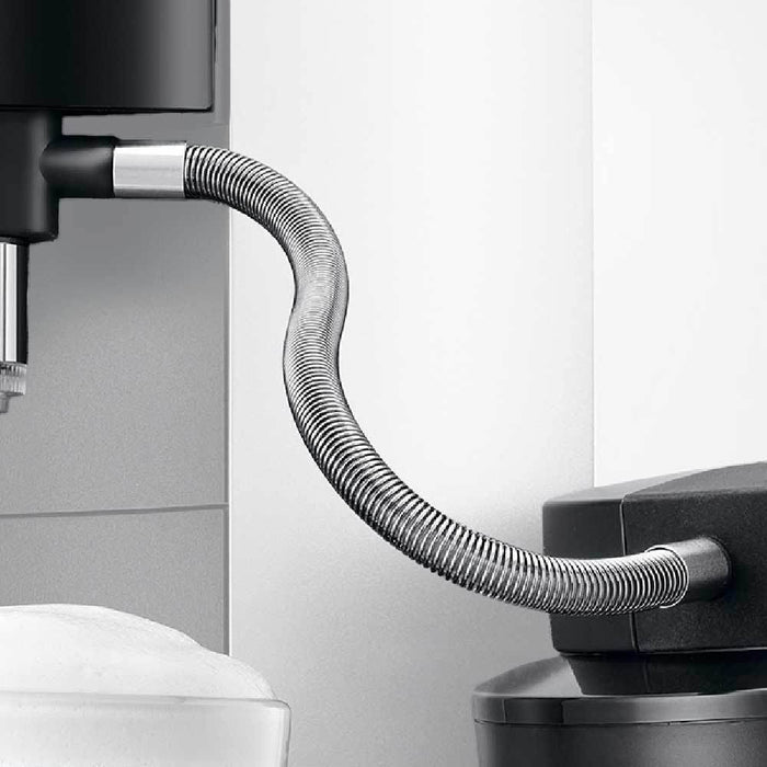 Close up of Jura Stainless Steel Milk Pipe attached to coffee machine and milk container
