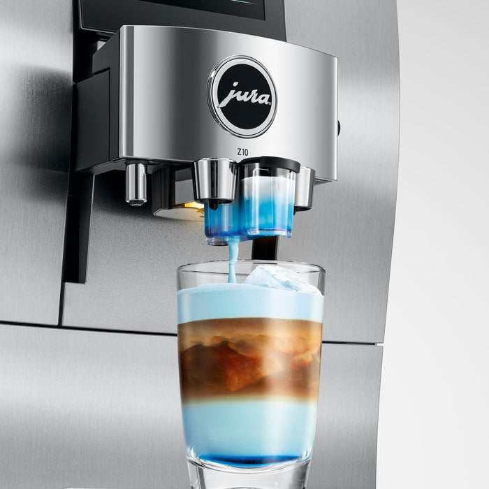 Jura syrup attachment for Jura automatic coffee machines pouring syrup into coffee