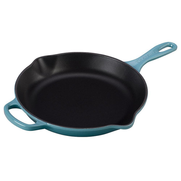 Caribbean Le Creuset 10.25″ Enameled Cast Iron Signature Round Skillet with Handle displayed on a white background