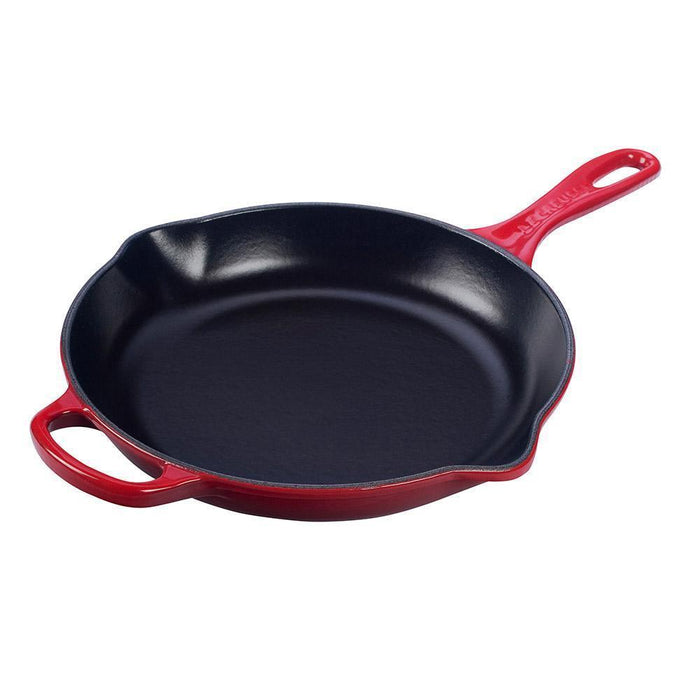 Cerise Le Creuset 10.25″ Enameled Cast Iron Signature Round Skillet with Handle displayed on a white background