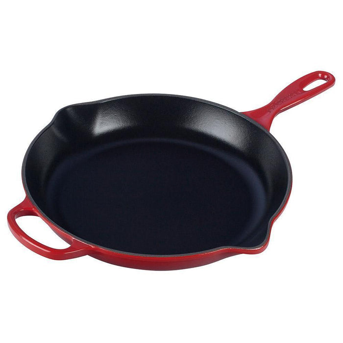 Cerise Le Creuset 11.75″ Enameled Cast Iron Signature Round Skillet with Handle displayed on a white background