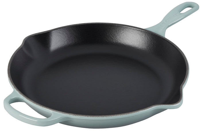 Sea salt Le Creuset cast iron signature round skillet with handle on a white background