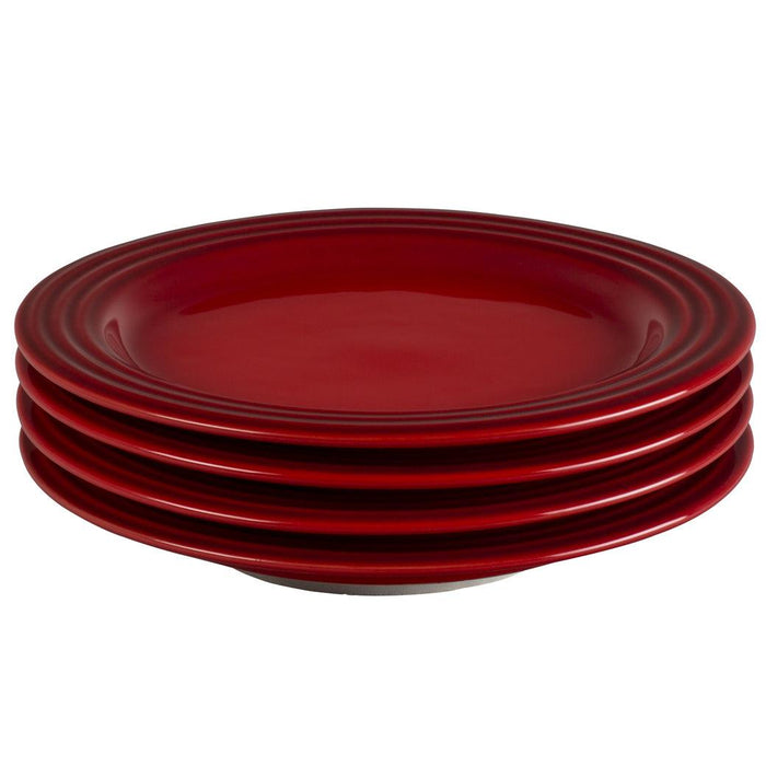 Set of 4 Cerise Le Creuset plates displayed on a white background