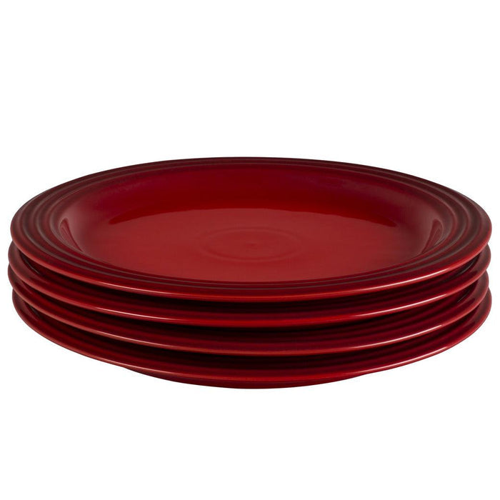 Set of 4 Cerise Le Creuset plates displayed on a white background