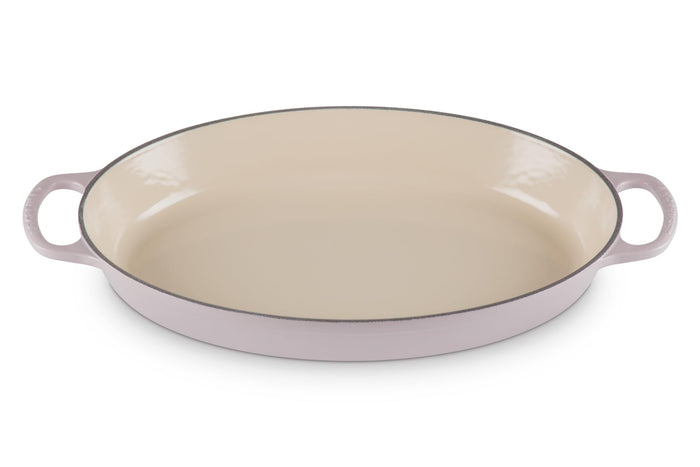 Shallot Le Creuset 3 qt enameled cast iron signature oval baker sand interior dutch oven with handles on a white background