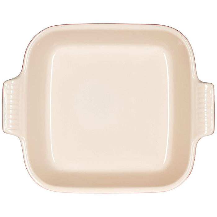 Top view of Le Creuset 3 qt Heritage Square Dish with a cream interior displayed on a white background