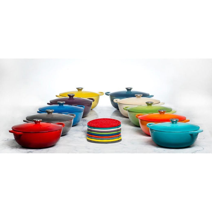 Set of an assortment of colorful Le Creuset cookware displayed on a white background